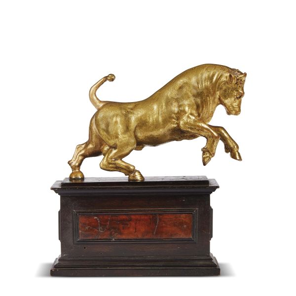 After Giambologna, Florentine, 17th century, A bull, gilt bronze on an ebonized wooden base, 14x21x7 cm, (base 10,3x19,5x10)