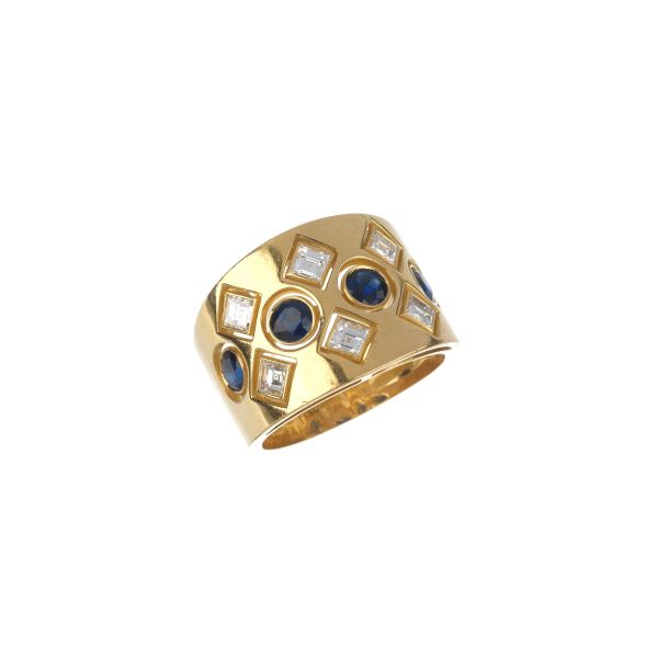 



SAPPHIRE AND DIAMOND BAND RING IN 18KT YELLOW GOLD 