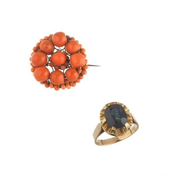 A SAPPHIRE RING WITH A CORAL BROOCH