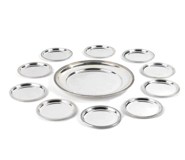 ELEVEN SILVER COASTERS AND ONE SILVER PLATE, 20TH CENTURY