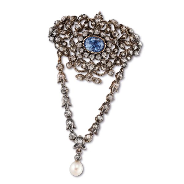 



BIG CEYLON SAPPHIRE DIAMOND AND PEARL PENDING BROOCH IN GOLD AND SILVER 