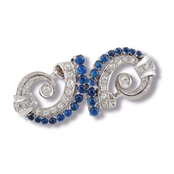 



SPILLA A DOPPIA CLIP CON ZAFFIRI CABOCHON E DIAMANTI