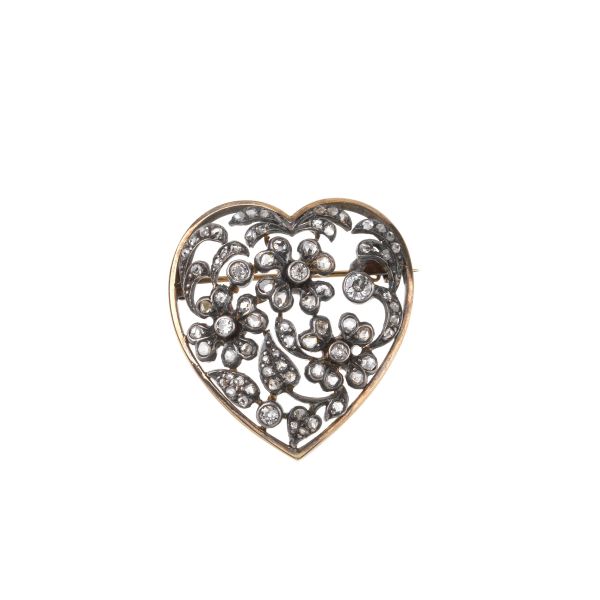 



DIAMOND HEART SHAPED BROOCH IN GOLD AND SILVER 