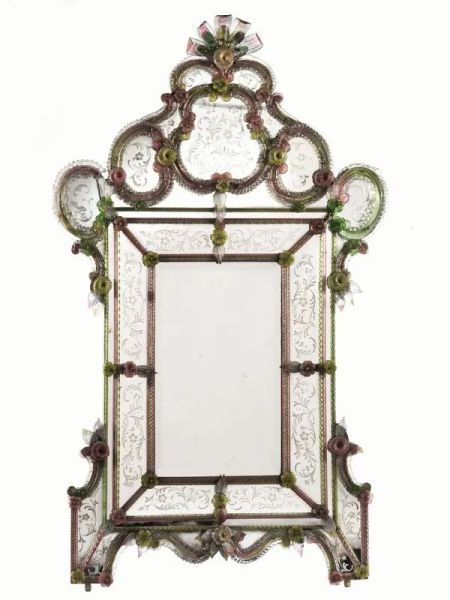 Grande specchiera di Murano, in vetro policromo, cornice sagomata decorata a motivi floreali in verde e rosa, specchio rettangolare con bordi incisi all'acido, piedi a voluta, cm 190x115, alcuni danni e mancanze