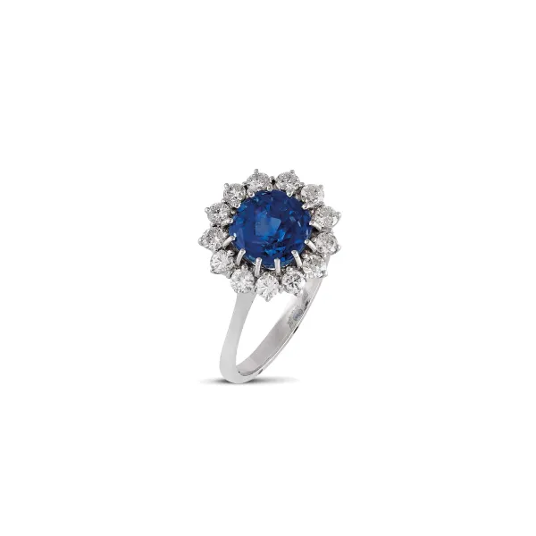 



CEYLON SAPPHIRE AND DIAMOND FLOWER RING IN 18KT WHITE GOLD