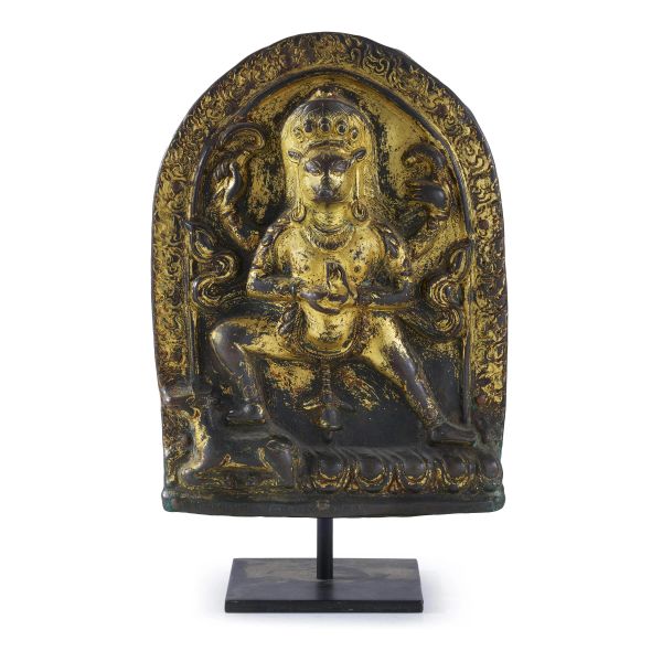 



A GILT BRONZE PLAQUE OF A TIBETAN DEITY, TIBET, 18TH CENTURY