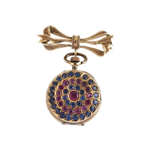 PICCOLO OROLOGIO DA TASCA CON RUBINI E ZAFFIRI CON SPILLA A FIOCCO