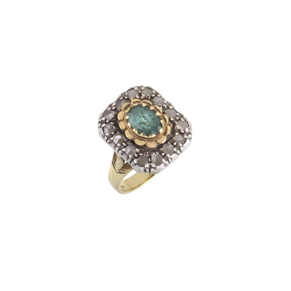 



EMERALD AND DIAMOND RING IN 18KT YELLOW GOLD AND SILVER