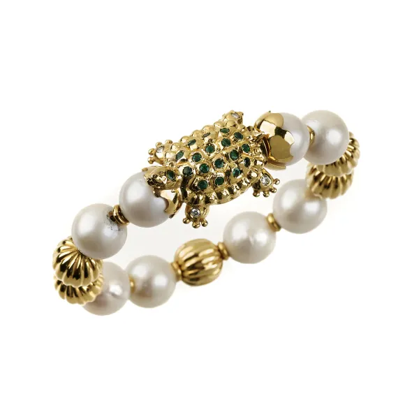 



PEARL AND DIAMOND BANGLE BRACELET IN 18KT YELLOW GOLD