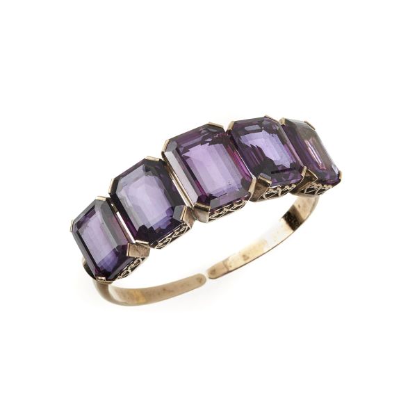 



BRACCIALE RIGIDO CON PIETRE SINTETICHE