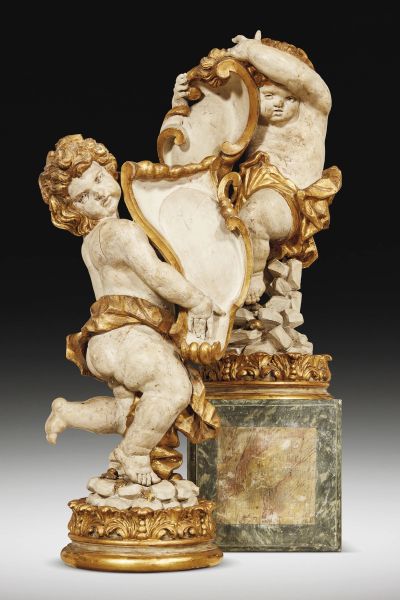 Giacomo Serpotta - Attribuited to Giacomo Serpotta (Palermo 1656 - 1732), A pair of sculptures, lacquered and gilt wood, portraying holding-emblem putti, on circular wooden bases, 108x55x36 cm and 106x52x38 cm