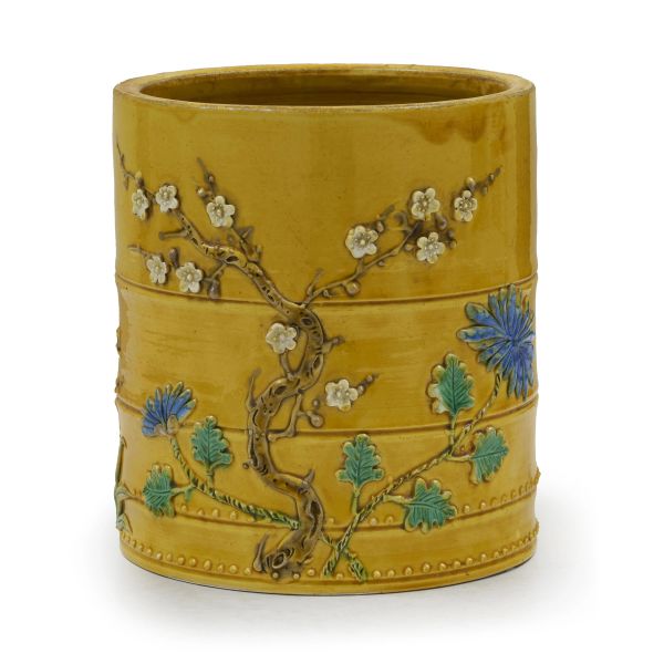 



A YELLOW-GLAZED POLYCHROME RELIEF-DECORATED BRUSH POT WITH 'FOUR GENTLEMEN' MOTIF (PLUM, ORCHID, BAMBOO, CHRYSANTHEMUM), CHINA, QING DYNASTY, SEC. XIX