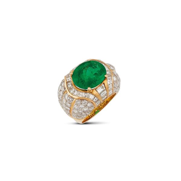 



COLOMBIAN EMERALD AND DIAMOND BAND RING IN 18KT TWO TONE GOLD