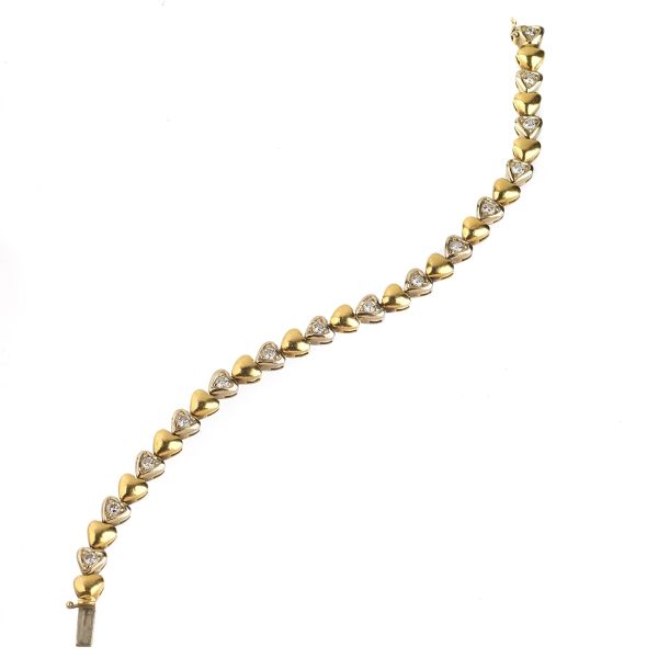 HEART-SHAPED DIAMOND BRACELET IN 18KT TWO TONE GOLD