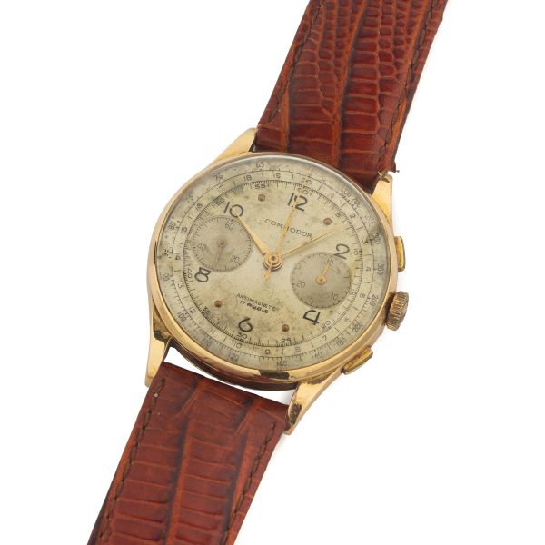 



COMMODOR YELLOW GOLD AND METAL CHRONOGRAPH 