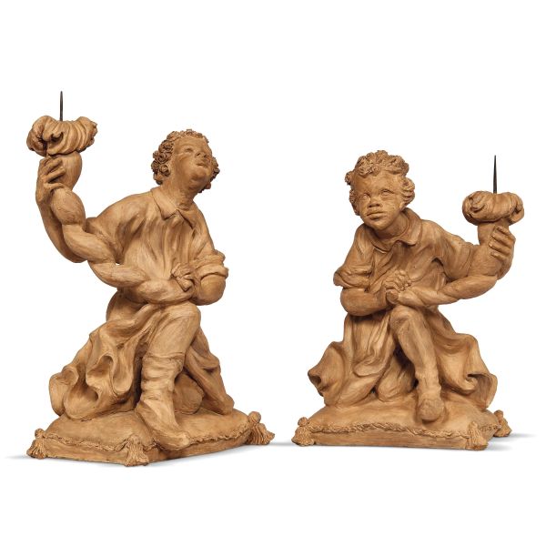 Venice, 18th century, A pair of moors holding chandeliers, terracotta, 46x34x26 cm and 43x35x24 cm