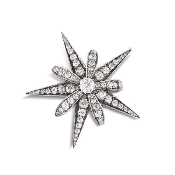 



DIAMOND STAR SHAPED BROOCH IN GOLD AND SILVER 