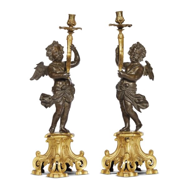 Roman, late 17th century, A pair of putti holding chandeliers with floral motifs and bobeches, 53,5x17,5x16 cm