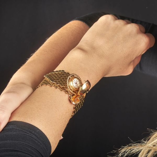 BRACCIALE A NASTRO CON OROLOGIO A SCOMPARSA