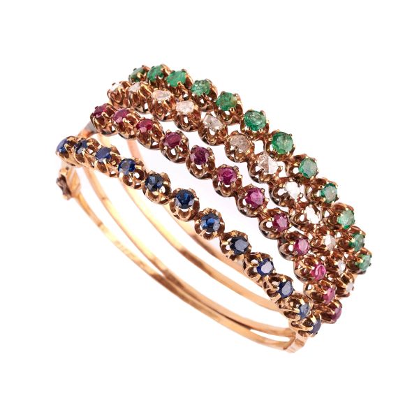 



FOUR MULTI GEM BANGLE BRACELETS IN 9KT GOLD