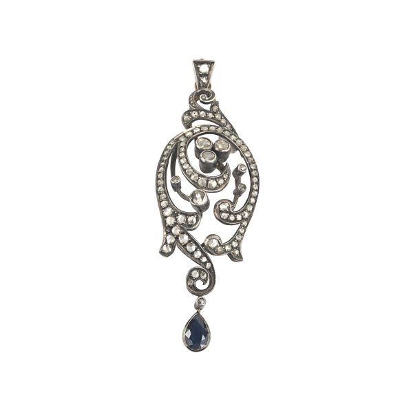 DIAMOND AND SYNTHETIC SAPPHIRE FLORAL BROOCH IN SILVER AND 18KT YELLOW GOLD