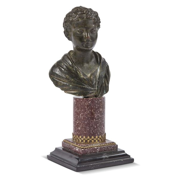 Rome, 17th century, A bust of a child, bronze, h. 11 cm on a porphyry base, 19,5x8,5x8 cm (overall)