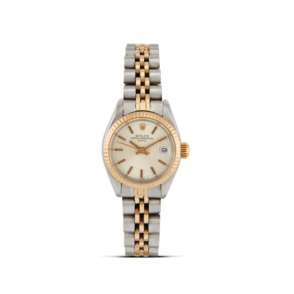 Rolex - 



ROLEX DATE LADY REF. 6917 N. 673..XX STAINLESS STEEL AND GOLD WRISTWATCH, 1981