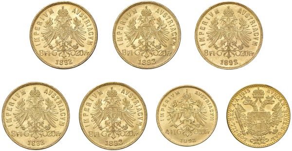 AUSTRIA. CINQUE MONETE DA 20 FRANCHI E DUE MONETE DA 10 FRANCHI ORO