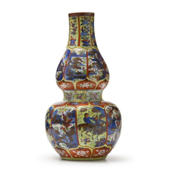 



A BLUE AND WHITE PORCELAIN DOUBLE-GOURD VASE, CHINA, QING DYNASTY, 18TH CENTURY, LATER ENAMELLED IN EUROPE