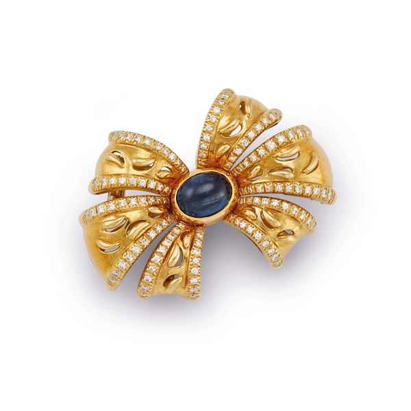 Faraone - 



FARAONE BOW-SHAPED BROOCH WITH SAPPHIRE AND DIAMONDS