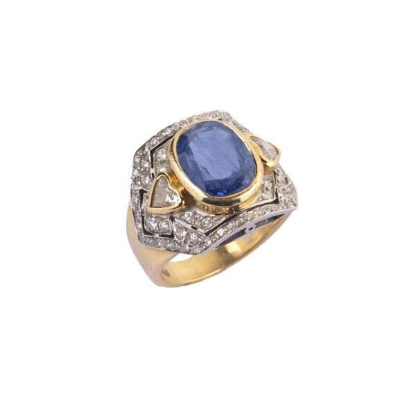



SAPPHIRE AND DIAMOND BAND RING IN 18KT TWO TONE GOLD