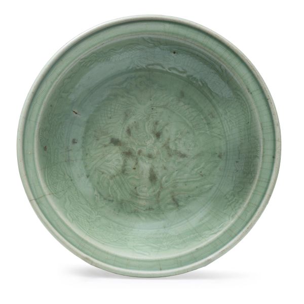 



A CELADON-GLAZED MOLDED &lsquo;PHOENIX&rsquo; DISH, CHINA, 15TH-16TH CENTURY