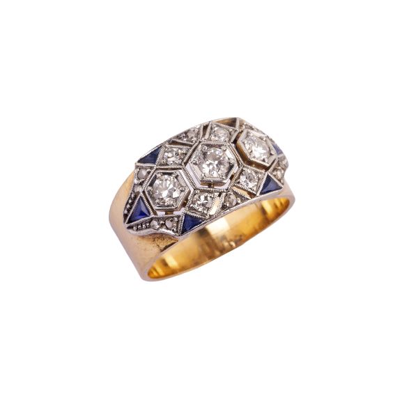 



DIAMOND AND SAPPHIRE BAND RING IN 18KT YELLOW GOLD