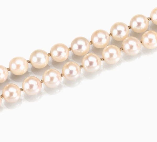 Collana in oro bianco, perle, rubini e diamanti