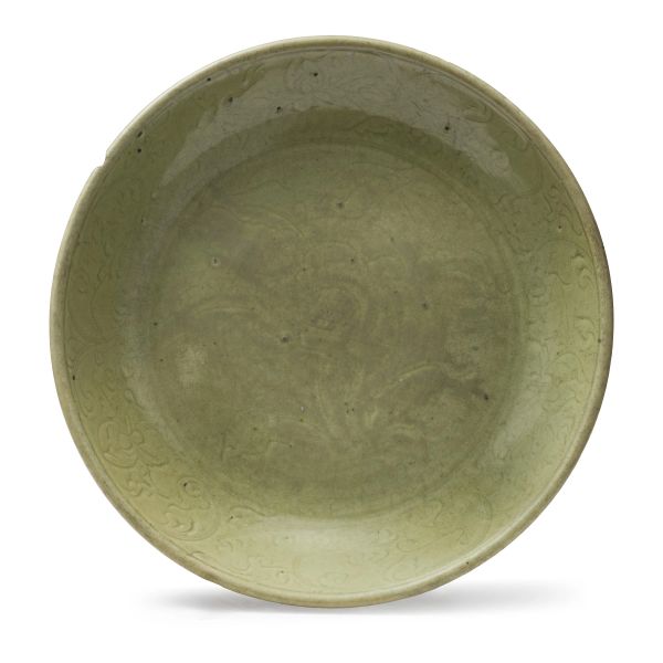 



A CELADON-GLAZED MOLDED DISH, CHINA, 15TH-16Th CENTURY