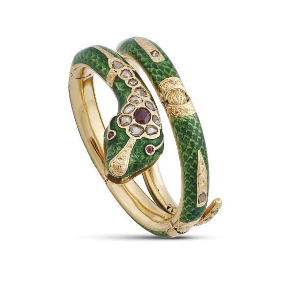 SNAKE-SHAPED RUBY AND DIAMOND BANGLE IN 18KT YELLOW GOLD