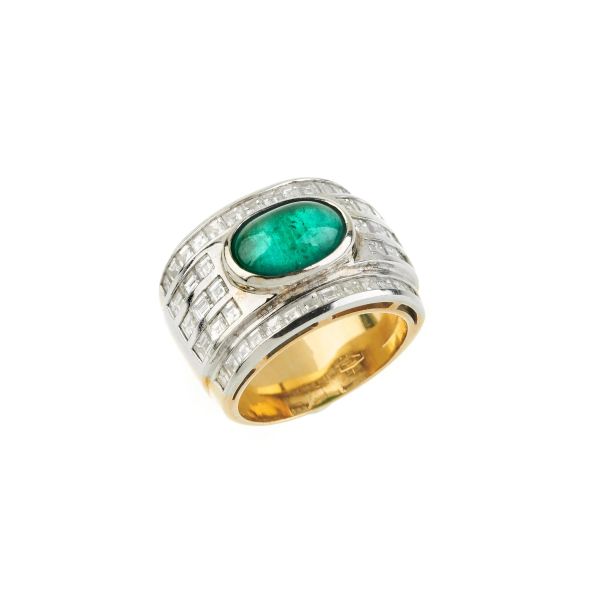 



EMERALD AND DIAMOND BAND RING IN 18KT TWO TONE GOLD