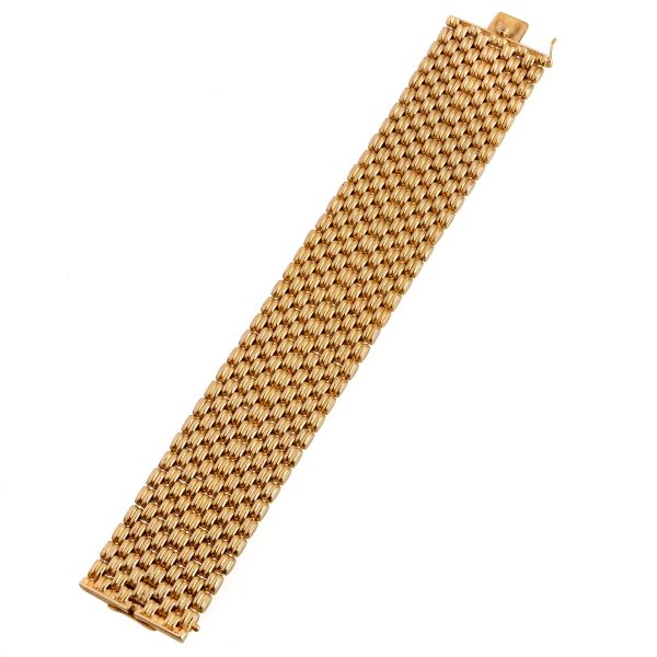 



WIDE BAND BRACELET IN 18KT YELLOW GOLD