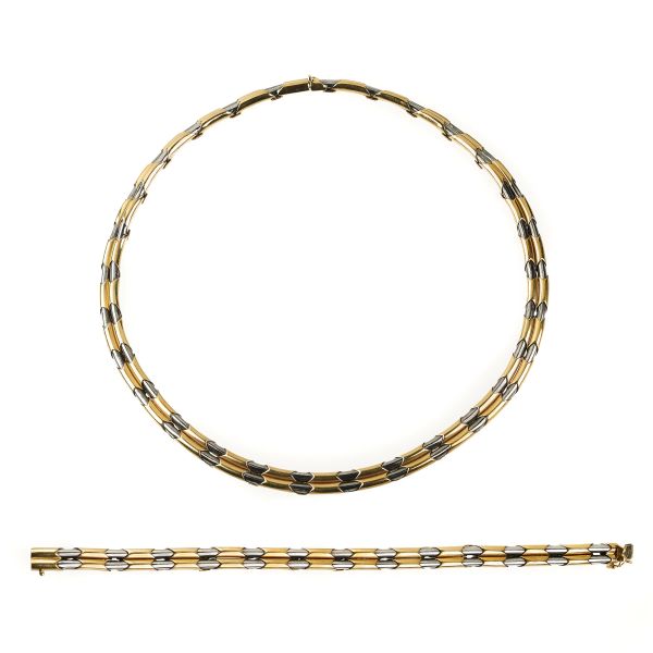 



CHIMENTO DEMI PARURE IN 18KT YELLOW GOLD AND STEEL