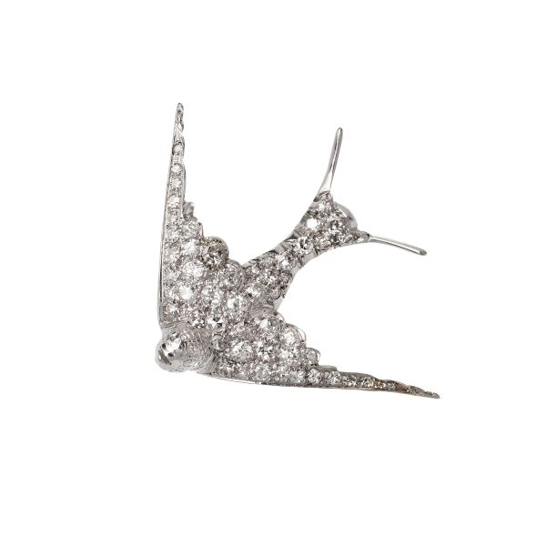



DIAMOND SWALLOW-SHAPED BROOCH IN 18KT WHITE GOLD