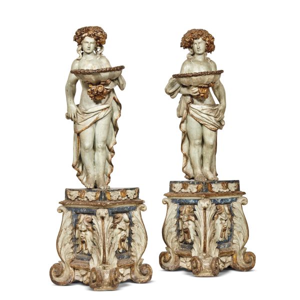 A PAIR OF TUSCAN VASE-HOLDING SCULPTURES, EARLY 18TH CENTURY
