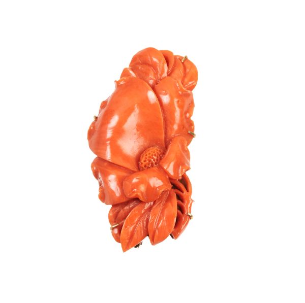 CARVED CORAL AND GOLD BROOCH