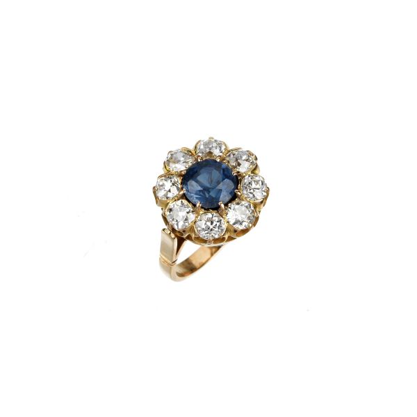 



SYNTHETIC SAPPHIRE AND DIAMOND RING IN 18KT YELLOW GOLD