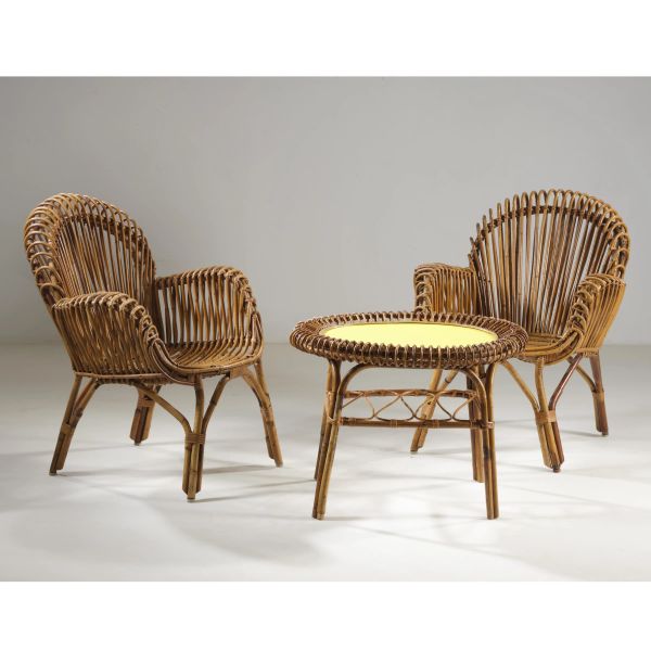 



A COUPLE OF ARMCHAIRS AND A LOW TABLE 