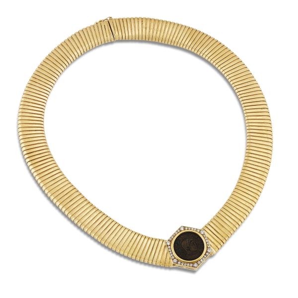 



TUBOGAS NECKLACE WITH A COIN IN 18KT YELLOW GOLD