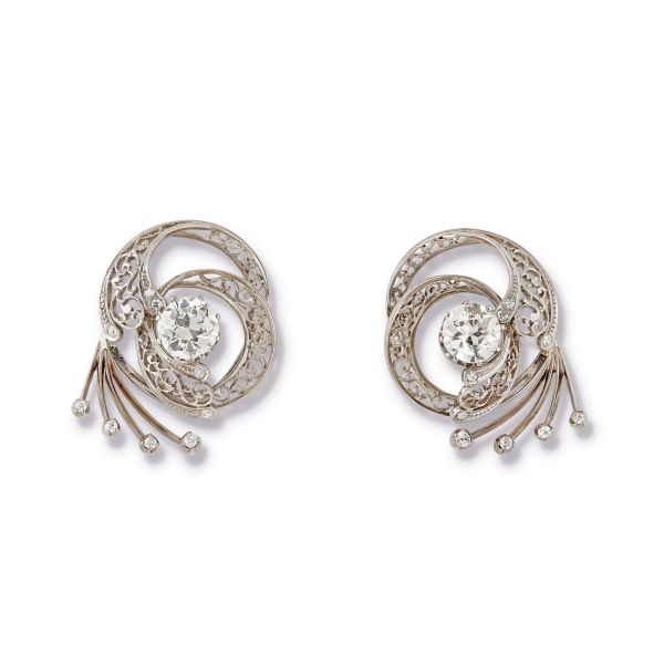 



PAIR OF DIAMOND BROOCHES IN 18KT WHITE GOLD