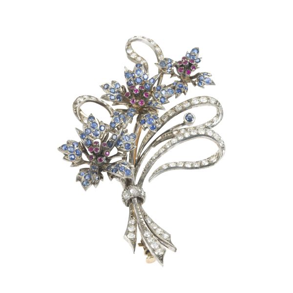 



FLORAL BROOCH WITH DIAMONDS, RUBIES AND SAPPHIRES