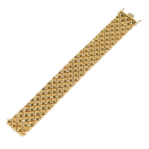 



WIDE BAND BRACELET IN 18KT YELLOW GOLD 