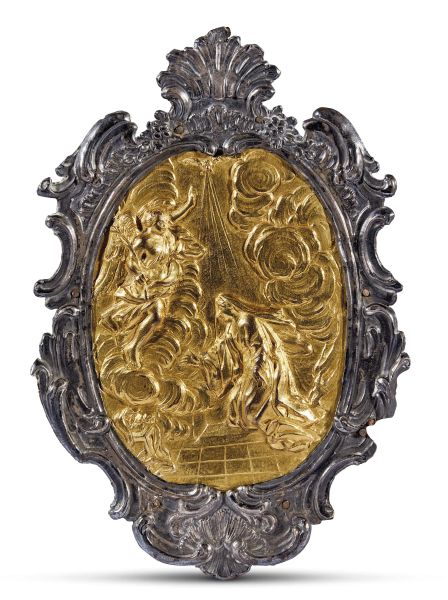 Central Italian, late 17th century, The Annunciation, gilt copper within silver foil frame applied on wooden support