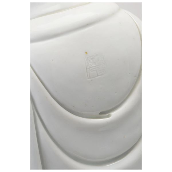 A DEHUA KILN WHITE-GLAZED FIGURE OF GUANYIN, CHINA, QING DYNASTY, XIX-XX CENTURY